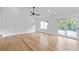 A spacious bedroom boasts hardwood floors, recessed lighting, ceiling fan and sliding glass door at 1194 Clearview Ne Dr, Brookhaven, GA 30319