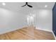 Bright bedroom with modern ceiling fan and hardwood floors at 1194 Clearview Ne Dr, Brookhaven, GA 30319