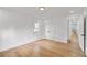 A minimalist bedroom with hardwood floors and natural light streaming through the window at 1194 Clearview Ne Dr, Brookhaven, GA 30319