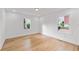 A bright bedroom with hardwood floors and natural light streaming through the windows at 1194 Clearview Ne Dr, Brookhaven, GA 30319