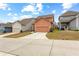 A two-story home with garage and manicured lawn in a neighborhood setting at 155 Concord Ct, Fayetteville, GA 30214