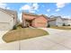 This two-story home features a front yard, garage, and ample parking space in the driveway at 155 Concord Ct, Fayetteville, GA 30214