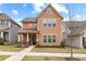 Charming two-story home featuring a well-manicured front yard and inviting curb appeal at 155 Concord Ct, Fayetteville, GA 30214