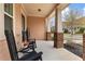 Inviting front porch with rocking chairs, creating a relaxing outdoor space at 155 Concord Ct, Fayetteville, GA 30214