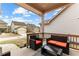 Cozy, covered porch offers outdoor seating, creating a welcoming and relaxing space at 155 Concord Ct, Fayetteville, GA 30214