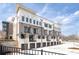 New townhome with attached garages, neutral colors and updated exterior design at 7110 Summit Pl, Alpharetta, GA 30009