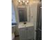 Charming bathroom featuring a stylish mirror, modern vanity, and ample natural light from the window at 2565 Cloud Ln, Decatur, GA 30034