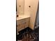 Chic bathroom featuring a vanity, modern fixtures, decorative wall tile, and attractive floor tiles at 2565 Cloud Ln, Decatur, GA 30034