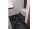 Elegant bathroom with freestanding tub, stylish tile floors, and a modern glass shower at 2565 Cloud Ln, Decatur, GA 30034