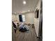 Bedroom features a bed, stylish area rug, and a mounted flat screen television at 2565 Cloud Ln, Decatur, GA 30034