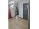 Bright living room featuring modern lighting, wood-look floors, and freshly painted grey trim at 2565 Cloud Ln, Decatur, GA 30034