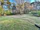 Large, grassy backyard with mature trees at 6917 Laurelwood Dr, Douglasville, GA 30135