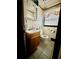Compact bathroom with a toilet, sink, and vanity at 6917 Laurelwood Dr, Douglasville, GA 30135