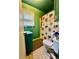 Bathroom featuring a walk-in shower with shower curtain, toilet, and sink at 6917 Laurelwood Dr, Douglasville, GA 30135