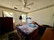 Bedroom with natural light, ceiling fan, and small bed at 6917 Laurelwood Dr, Douglasville, GA 30135