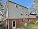 A multi-level home featuring brick facade and vinyl siding with multiple windows at 6917 Laurelwood Dr, Douglasville, GA 30135