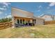 Large backyard with a covered patio perfect for entertaining and outdoor living at 1661 Flagstone Ln, Conyers, GA 30012