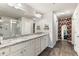 Spacious bathroom featuring double sinks, granite countertops and a separate glass shower at 1661 Flagstone Ln, Conyers, GA 30012