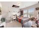 Bright bedroom featuring colorful bedding, string lights, and decorative wall art at 1661 Flagstone Ln, Conyers, GA 30012