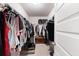 Walk-in closet with ample hanging space and shelving for organized storage at 1661 Flagstone Ln, Conyers, GA 30012