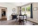 Charming dining area features wood floors, a round table with four chairs, and a view of the outdoors at 1661 Flagstone Ln, Conyers, GA 30012