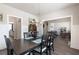Open dining area with a large table, flowing into the living spaces for seamless entertaining at 1661 Flagstone Ln, Conyers, GA 30012