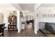 Spacious hallway with wood floors, connecting the dining area to the living room at 1661 Flagstone Ln, Conyers, GA 30012