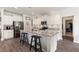 Well-appointed kitchen features white cabinetry, granite countertops, and stainless steel appliances at 1661 Flagstone Ln, Conyers, GA 30012