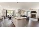 Bright, open kitchen flows into the living room, featuring granite countertops and ample seating at 1661 Flagstone Ln, Conyers, GA 30012