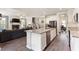 Open concept kitchen boasts granite countertops, stainless steel appliances, and seamless flow to the living area at 1661 Flagstone Ln, Conyers, GA 30012