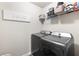 Laundry area with modern washer and dryer at 1661 Flagstone Ln, Conyers, GA 30012