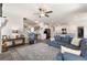 Open concept living space with hardwood floors, fireplace, and seamless flow to the kitchen at 1661 Flagstone Ln, Conyers, GA 30012