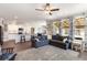 Open-concept living space featuring a modern kitchen, living room, and backyard views at 1661 Flagstone Ln, Conyers, GA 30012