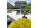 Landscaped backyard with pool, lounge chairs, and patio area, creating a private outdoor retreat at 526 Rosemont Ave, Canton, GA 30115