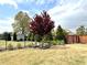 Fenced backyard with a well-maintained lawn and garden, providing privacy and tranquility at 526 Rosemont Ave, Canton, GA 30115