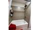 Bathroom shower featuring tile surround, rainfall shower head and toiletry storage at 526 Rosemont Ave, Canton, GA 30115