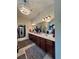 Bathroom featuring dual sinks, decorative lighting, large mirrors and elegant finishes at 526 Rosemont Ave, Canton, GA 30115