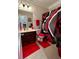 Bathroom boasts coordinated red accessories and a stylish shower curtain at 526 Rosemont Ave, Canton, GA 30115