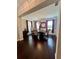 Formal dining room with dark hardwood floors, stylish chandelier, and ample natural light at 526 Rosemont Ave, Canton, GA 30115