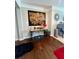 Entryway with a decorative table, wall art, and hardwood floors at 526 Rosemont Ave, Canton, GA 30115