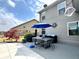 Outdoor patio features dining set, barbecue, and tasteful decor, perfect for outdoor entertaining at 526 Rosemont Ave, Canton, GA 30115