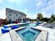 Backyard view of the pool, including a spa and slide, surrounded by serene landscaping and lounge area at 526 Rosemont Ave, Canton, GA 30115