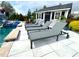 Relaxing poolside retreat with lounge chairs, a pool house, and meticulous landscaping at 526 Rosemont Ave, Canton, GA 30115
