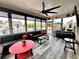 Spacious sunroom featuring a large seating area, ceiling fan, and a view of the pool at 526 Rosemont Ave, Canton, GA 30115
