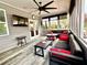 Bright sunroom with comfortable seating, a ceiling fan, and views of the outdoors at 526 Rosemont Ave, Canton, GA 30115