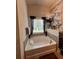 Bathroom boasting a soaking tub under a window providing natural light at 526 Rosemont Ave, Canton, GA 30115