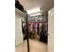 Walk-in closet with organized storage, bright lighting, and space for shoes at 526 Rosemont Ave, Canton, GA 30115