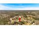 A scenic aerial view of the neighborhood surrounded by lush trees under a bright blue sky at 81 Bridgemill Dr, Douglasville, GA 30134