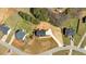 An aerial view of the property featuring a long drive, spacious yard, and mature trees at 81 Bridgemill Dr, Douglasville, GA 30134