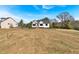 Residential home situated on a spacious lot with mature trees and manicured grass at 81 Bridgemill Dr, Douglasville, GA 30134